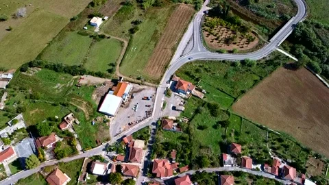 Aerial view of small village and crop fields at Autumn Stock Footage 224302953