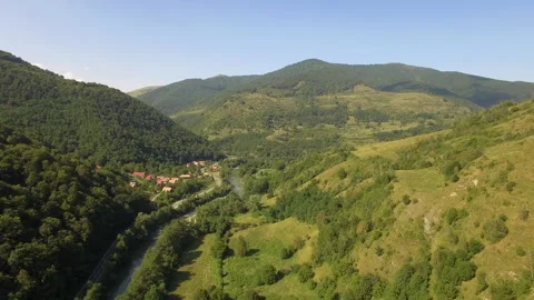 Aerial view of a small village between the mountains Stock Footage 151272375