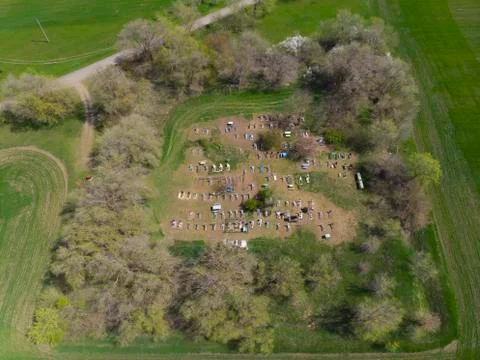 Aerial view of small village cemetery and forest Stock Photos