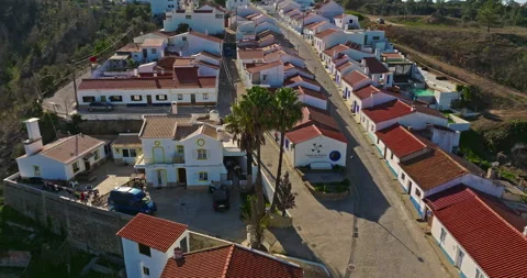 Aerial view of small village with windmill and picturesque rooftops, Odeceixe 動画素材 310681208