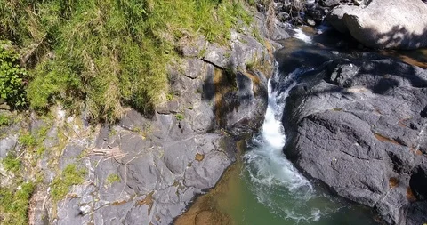 Aerial view of a small water fall in a river Stock Footage 90537144