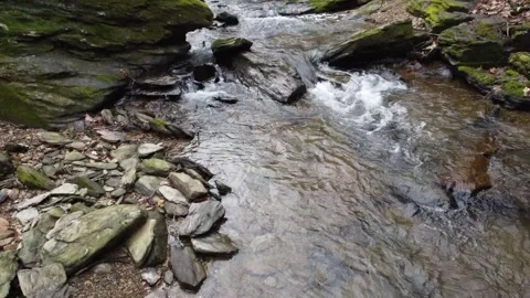 Aerial View of Small Waterfall Tilting Down Video stock 235025889