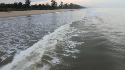 Aerial view of Small Waves Splashing on the Beach in Malaysia Stock Footage 147371304