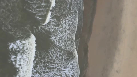 Aerial view of Small Waves Splashing on the Beach in Malaysia Stock Footage 147567949