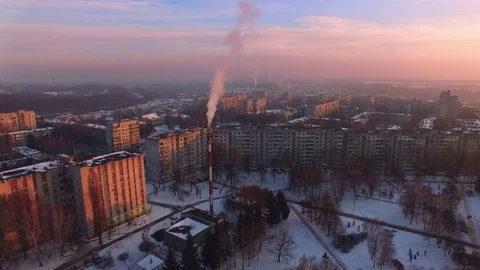 Aerial view on smoke pipe at evening winter city Stock-Footage 71651946