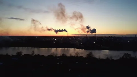 Aerial View Smoking Stack in Sunrise. Air Pollution and Climate Change Theme. Видео 128155321