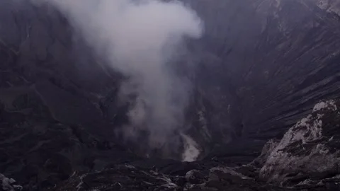 Aerial view of smoking volcano summit and crater, Bromo, East Java, Indonesia. Stock Footage 279735873