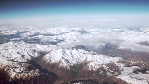 Aerial view of the snow capped Alps, rugged mountain peaks landscape. Stock Footage 313007746