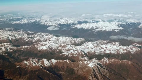 Aerial view of the snow capped Alps, rugged mountain peaks landscape. Stock Footage 314466024