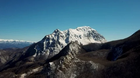 Aerial view of the snow-capped Mount Pania, in the Apuan Alps Stock Footage 125857607