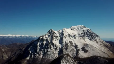Aerial view of the snow-capped Mount Pania, in the Apuan Alps Stock Footage 125857659
