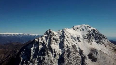 Aerial view of the snow-capped Mount Pania, in the Apuan Alps Stock Footage 125857780