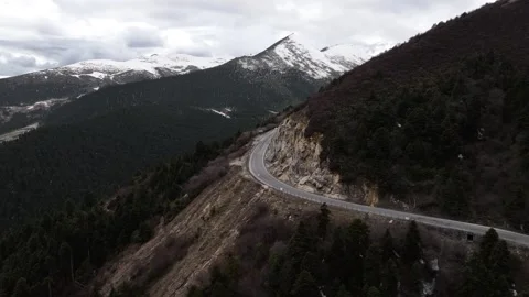 Aerial view of snow-capped mountain road at Sejila Mountain Pass G318 Tibet Stock Footage 306864946