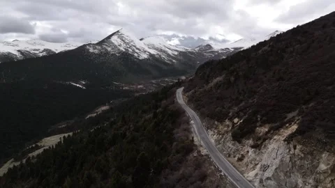 Aerial view of snow-capped mountain road at Sejila Mountain Pass G318 Tibet Stock Footage 306864959