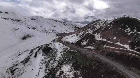 Aerial view of snow-capped mountain road at Sejila Mountain Pass G318 Tibet Stock-Footage 306864967