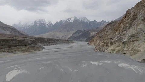Aerial view of a snow-capped mountain range in Pakistan, revealing a vast arid 스톡 동영상 314456174