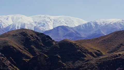 Aerial view of snow-capped mountains in Kyrgyzstan Stock Footage 329333508
