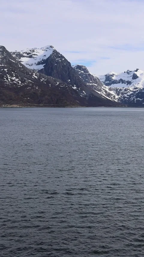 Aerial view of snow-capped mountains and a fjord in Norway. Stock Footage 337168395