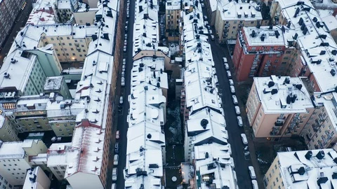 Aerial view of snow coverd rooftops in residential area Video stock 129777908