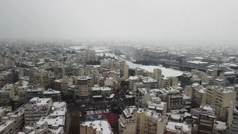 Aerial view of snow covered Athens, Greece as a cold front known as Madea hit Stock Footage 148564216