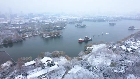 Aerial view of snow covered Daming Lake in Jinan during winter season Stock Footage 342209595