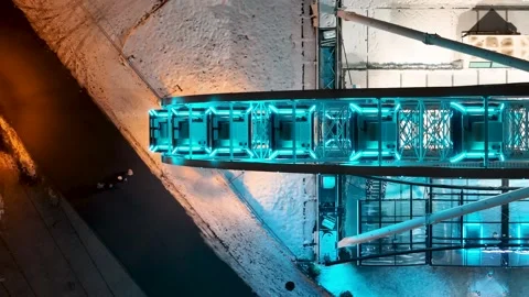 Aerial View of Snow-Covered Ferris Wheel with Blue Lighting Stock Footage 258145265