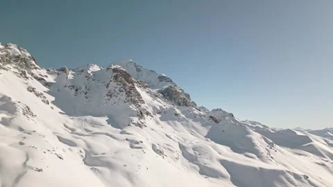 Aerial view of snow covered Mount Tetnuldi peak in Svaneti, Georgia, under .. Видео 312051027