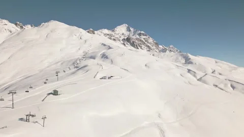 Aerial view of snow covered Mount Tetnuldi peak in Svaneti, Georgia, under .. Vídeos de archivo 312051063