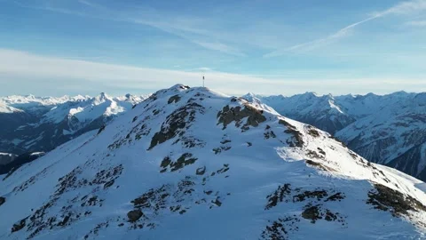 Aerial View of Snow Covered Mountain Peak and Alpine Range in Mayrhofen, Tyrol, Stock Footage 334784582