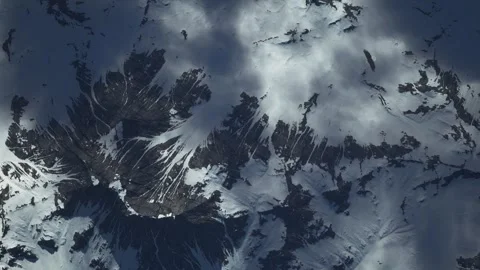 Aerial View of Snow-Covered Mountain Range with Deep Valleys Vídeos de archivo 339077474
