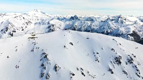Aerial view of snow covered mountain peaks in winter landscape footage. Stock-Footage 341068538