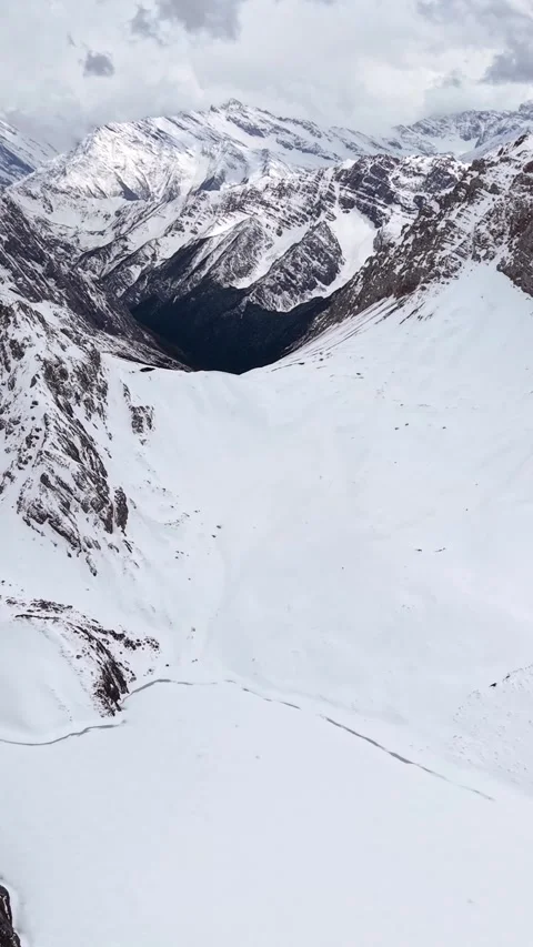 Aerial view of snow-covered mountain valley in western Sichuan Stock Footage 346159561