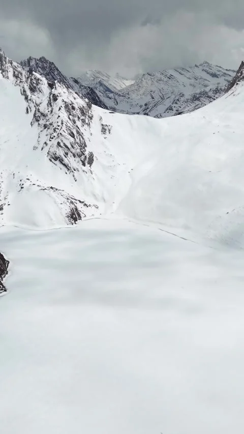 Aerial View of Snow-Covered Mountain Valley in Western Sichuan Stock Footage 346166870