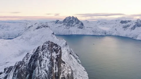 Aerial view of snow-covered mountains and tranquil water Stock Footage 330164662