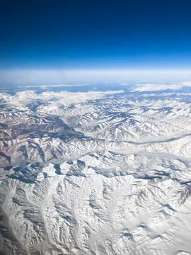 Aerial view of snow covered mountains Stock Photos