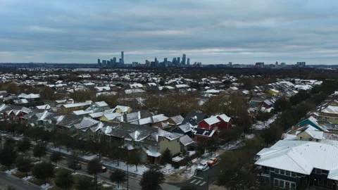 Aerial View of Snow-Covered Mueller Neighborhood with Austin Downtown Skyline Video stock 328337659