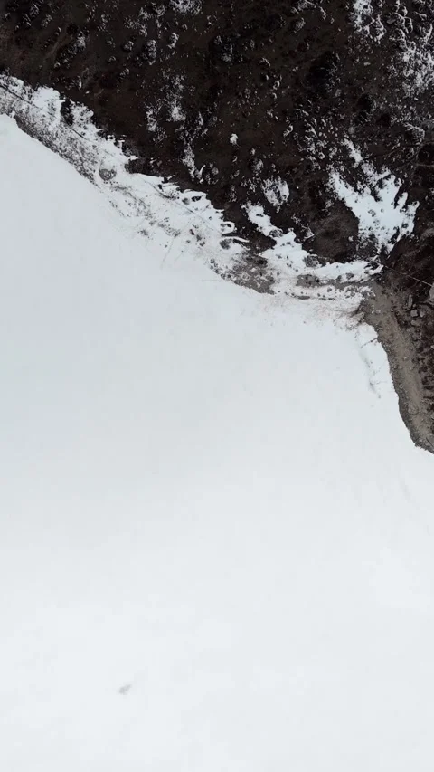 Aerial view of snow-covered valley edge in Qizang Gou, Sichuan Stock Footage 346166440