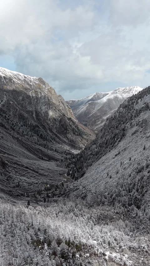 Aerial View of Snow-Covered Valley in Western Sichuan Stock Footage 346167672