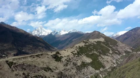 Aerial view of snow mountain peak rock canyon cloudy sky mountain scenery in Aba Video stock 337926334