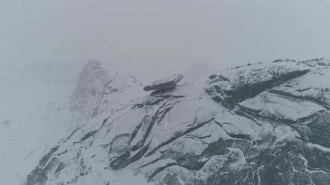 Aerial view of snow mountain range with Visayachiy kamen in Nature Park Ergaki Stock Footage 141776586
