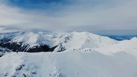 Aerial view of snow mountain range landscape in Zakopane under blue sky with Stock Footage 142213043