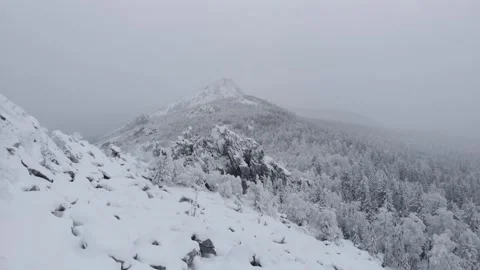 Aerial view of snow mountain range landscape 4k winter drone footage Video stock 148363369