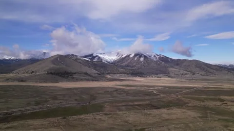 Aerial view of snow mountain range landscape Stock Footage 248002421