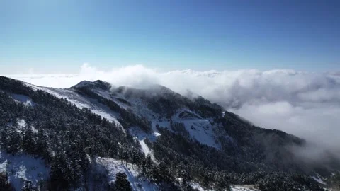 Aerial View of Snow Peak Mountain Low Altitude Cloud Sea in Shennongjia Hubei Stock Footage 337943242