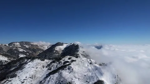 Aerial View of Snow Top Mountain Group Low Cloud Sea in Shennongjia Hubei China Video stock 337940248