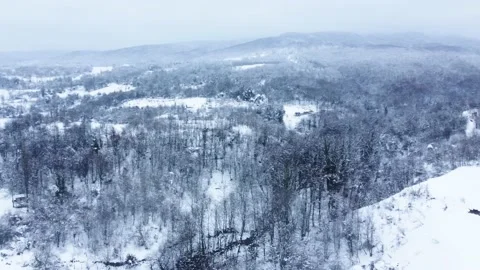 Aerial view of snowcapped mountain in winter season. Snowy valley . Stock Footage 233282048