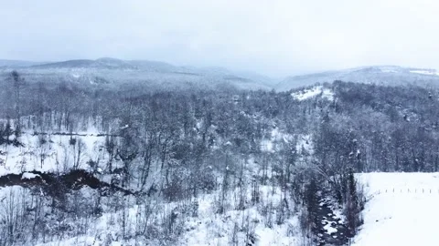 Aerial view of snowcapped mountain in winter season. Snowy valley . Stock Footage 233282183