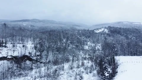 Aerial view of snowcapped mountain in winter season. Snowy valley . Stock Footage 233282226