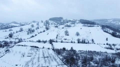 Aerial view of snowcapped mountain in winter season. Snowy valley . Stock Footage 233282244