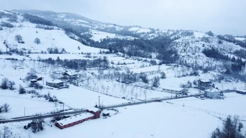Aerial view of snowcapped mountain in winter season. Snowy valley . Stock Footage 233282263